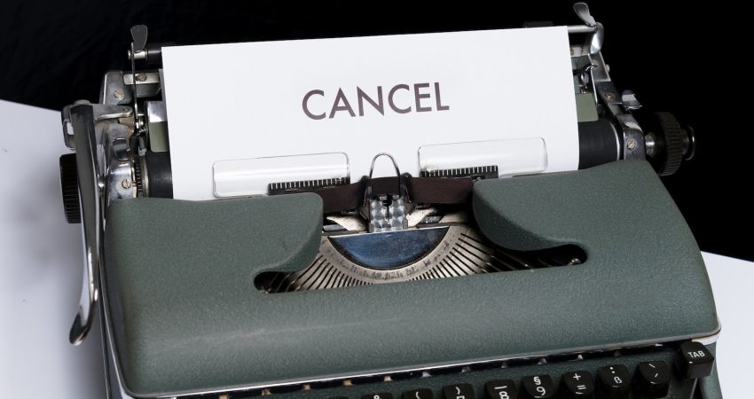 green and white typewriter on black textile